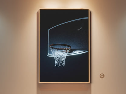 Framed basketball hoop canvas art is displayed in a living space. This minimalist sports print features a black blue net. Perfect wall decor for a man cave or sports-themed room. It adds a modern touch to any space. A great gift for basketball fans or hoopers.