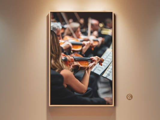 Experience the emotion of a live orchestra with this canvas art print. A violinist plays with passion in this artwork. The brown frame enhances the warm tones. This music-themed wall decor is perfect for music lovers. Add a touch of classical elegance to your office or home with this fine art piece.