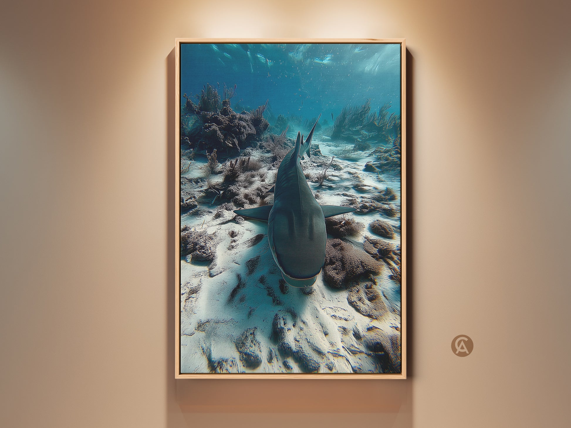 Photorealistic shark canvas print displayed in a stylish living room setting. The artwork captures an underwater scene with a shark swimming above a vibrant coral reef. This deep blue and teal ocean wildlife wall art serves as a captivating focal point bringing the ocean's majesty to any home or office decor