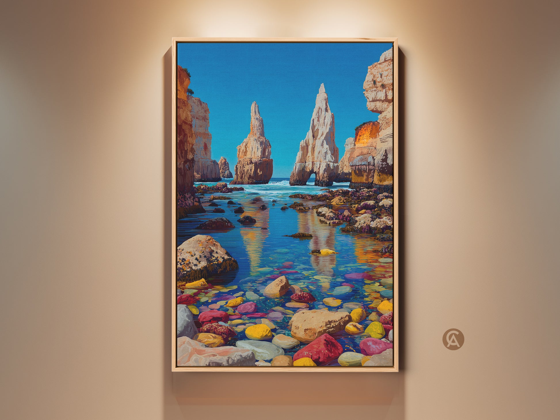 Framed colorful pebble beach artwork. Ocean cliffs landscape wall art perfect for coastal home decor. The bright blue and yellow artwork makes a great housewarming gift. The golden light reflects on the shallow sea with colorful pebbles.
