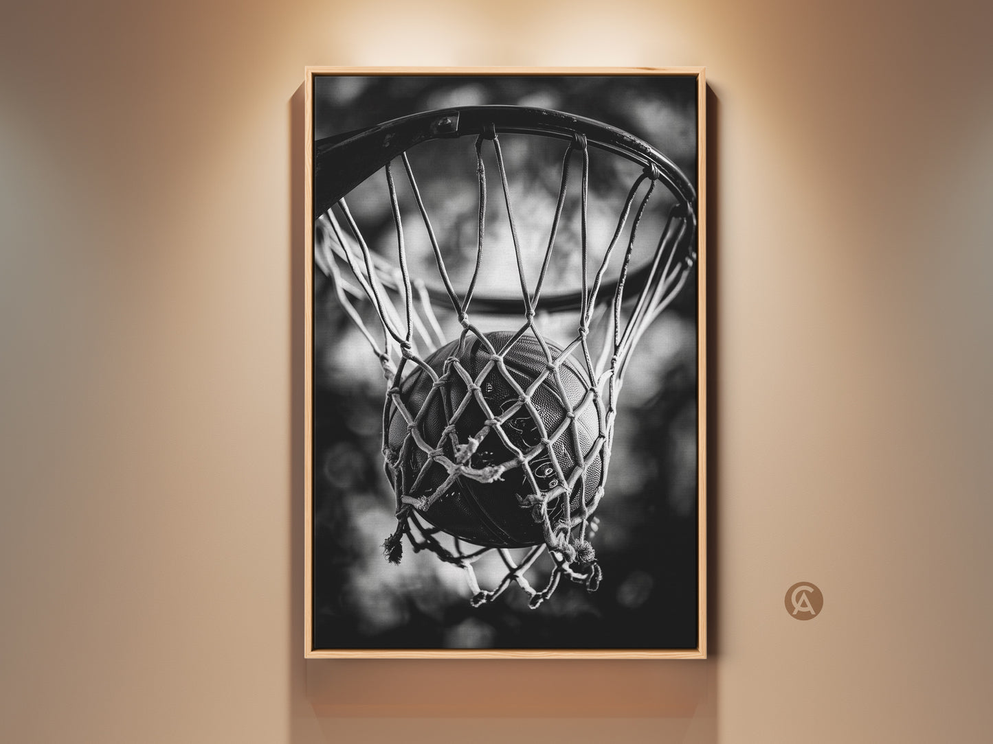 Framed basketball art in a room setting. The artwork is matted with a thin frame. It features a basketball swishing through a net. The black and white photo gives a classic look. Decorate your space with sports-themed wall decor.