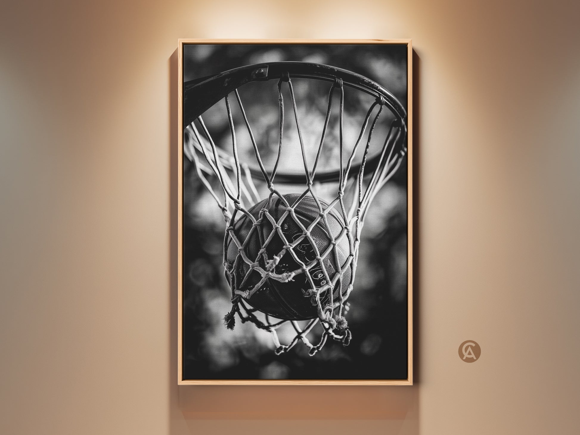 Framed basketball art in a room setting. The artwork is matted with a thin frame. It features a basketball swishing through a net. The black and white photo gives a classic look. Decorate your space with sports-themed wall decor.