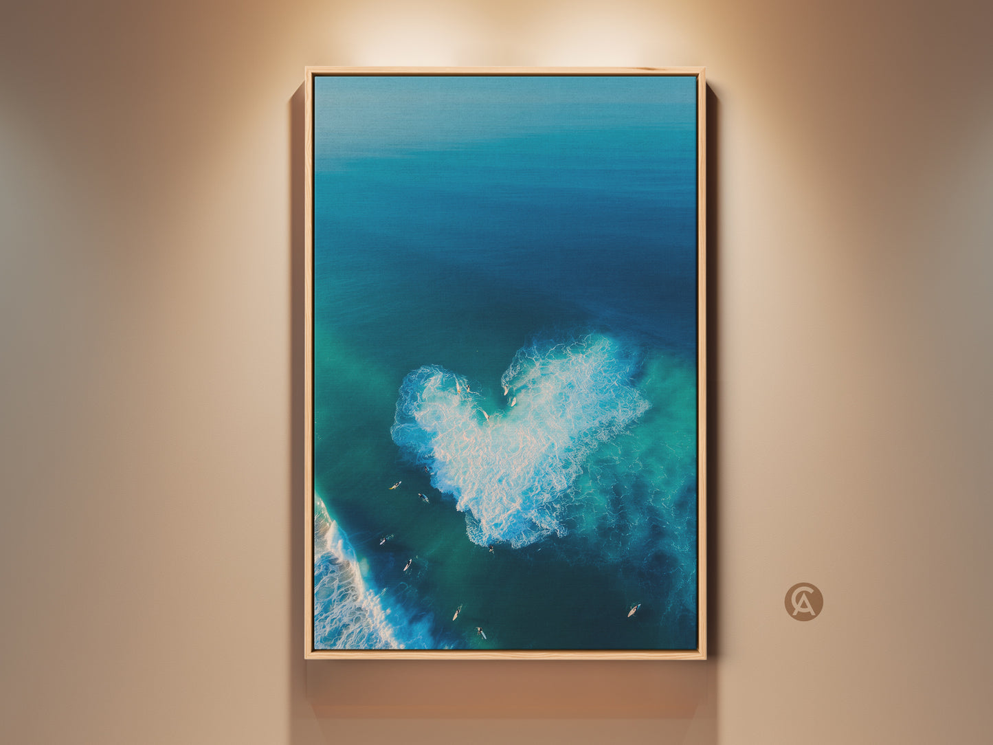 Framed beach art captures the ocean's beauty. This aerial view reveals a heart-shaped wave. Surfers dot the scene. The wall art has a natural wood frame. It enhances coastal decor. The artwork brings a serene ocean vibe to any space.