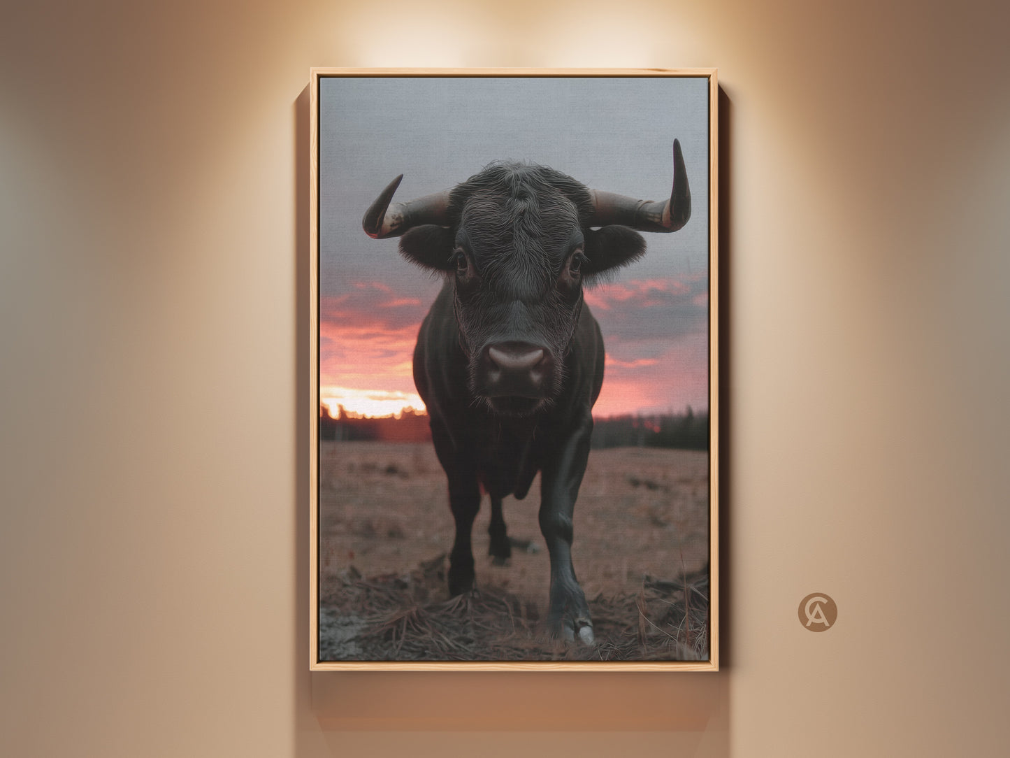 Framed rustic bull art print on a wall. It features a photorealistic animal in a farmhouse setting. The black bull artwork contrasts with the red sunset sky. Ideal bedroom home gift for wildlife and country lovers.