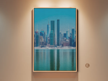 Modern NYC Skyline canvas art in a wood frame. This blue teal cityscape print offers a waterfront urban architecture view. Perfect wall decor for your office or living room. The contemporary artwork adds a touch of sophistication to any space.