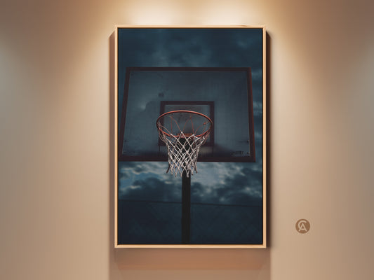 Urban sports photography featuring a basketball hoop art print. This industrial-style artwork has red gray and blue tones. Perfect teen room decor or a unique gift for basketball fans. The artwork is framed and ready to hang adding a sporty aesthetic.