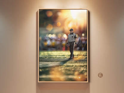 Sports referee artwork is displayed in a floating frame. The football action photography is bathed in golden hour light. This canvas print enhances any office decor or sports-themed space. A great gift for sports fans.