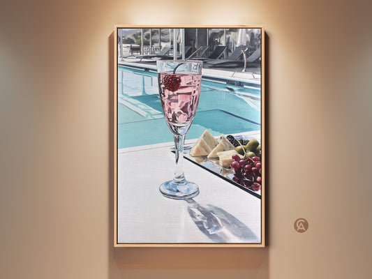Sophisticated poolside cocktail canvas art. This photorealistic artwork features a pink drink with cheese and grapes. It's perfect for luxury home decor adding elegance to a dining room or bar area. The contemporary style enhances any living space with its chic lifestyle art.
