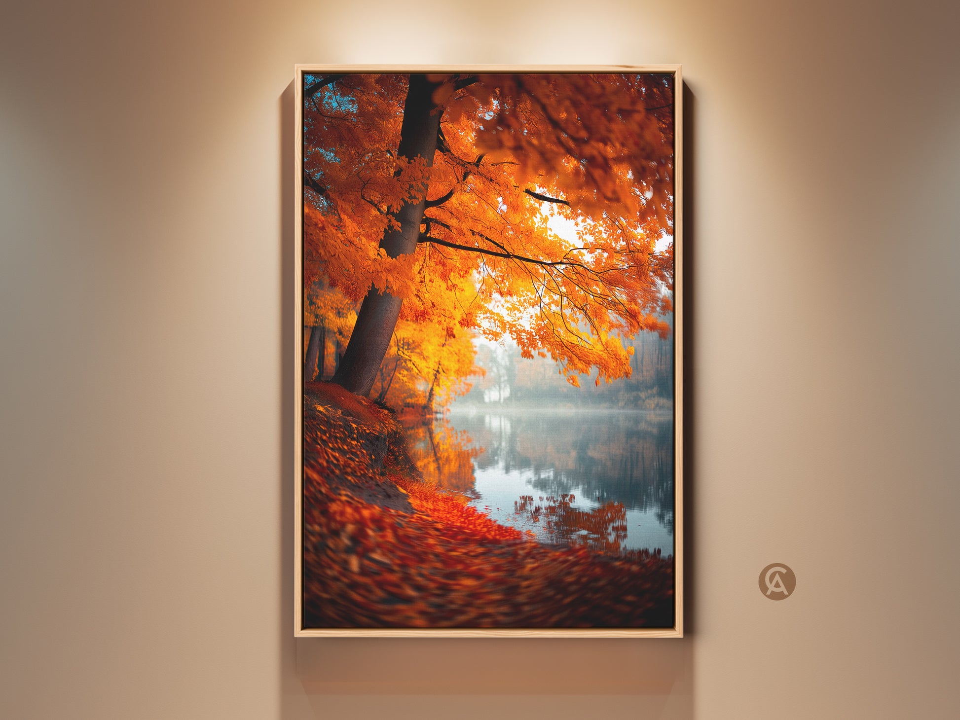 Framed Autumn Lake artwork. A vibrant tree with orange leaves lines the misty lake shore. Fallen leaves cover the ground. This serene nature art is perfect for adding warmth to any room. Shop now for framed or unframed options.