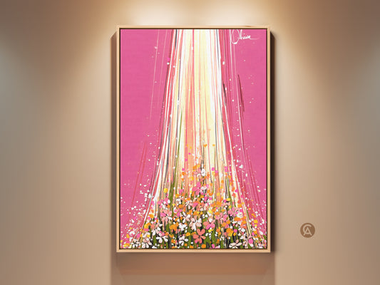 Framed abstract flower art print on a wall. This modern botanical artwork features bright pink and orange hues. The colorful floral canvas adds a spring touch to any room. Buy this vivid wall art as a gift for her.