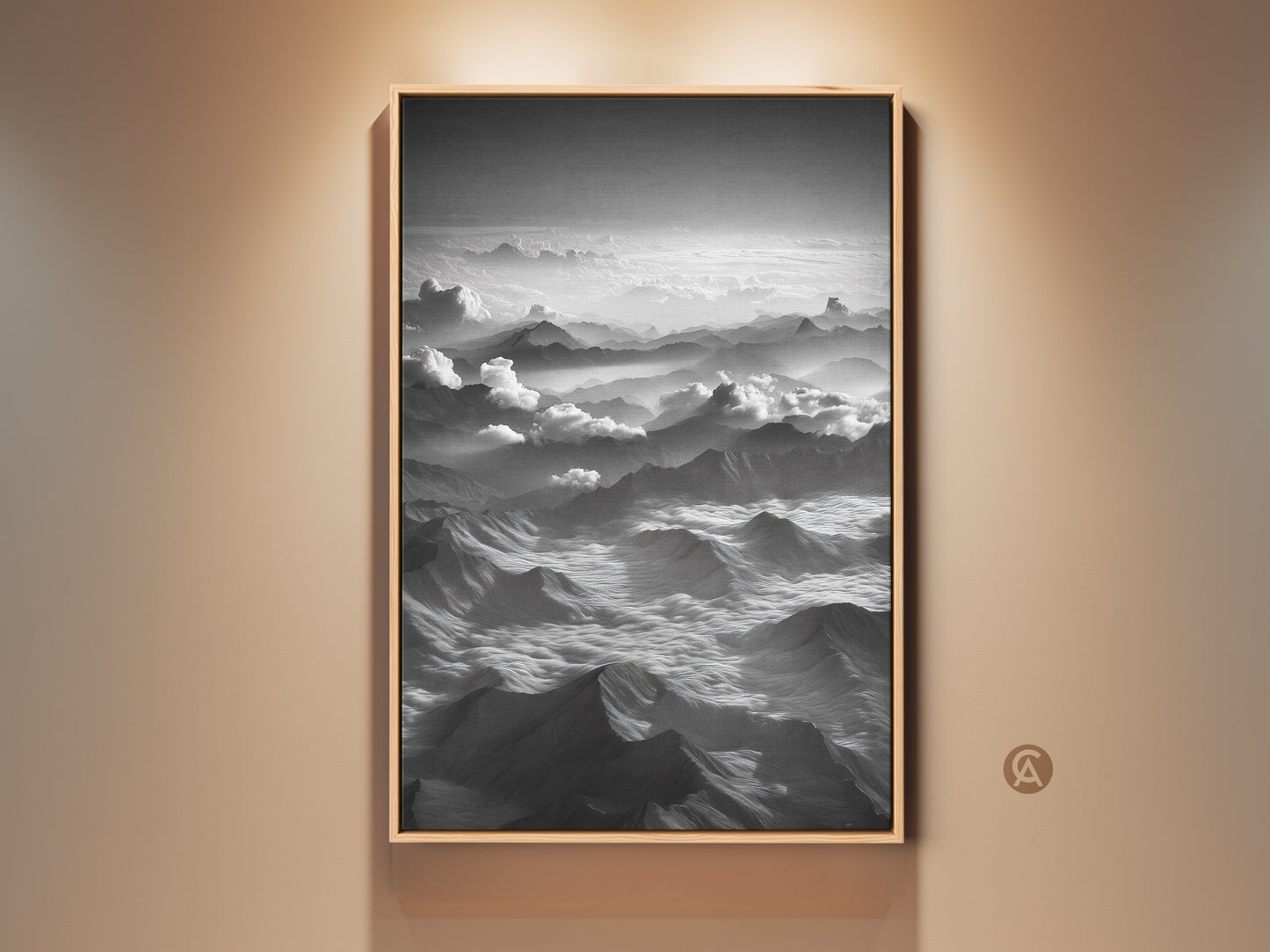 Framed monochrome mountain wall art showcases an aerial landscape canvas print. Black and white clouds artwork enhances modern nature decor. This serene mountainscape is a perfect gift for hikers. The black frame adds a sleek touch. This artwork complements any home interior wall.