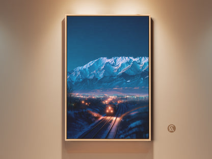 A framed canvas print showcases indigo mountains. A train approaches a cityscape at night. The blue and orange landscape artwork enhances home decor. It's a contemporary travel themed gift. The premium canvas captures winter magic.