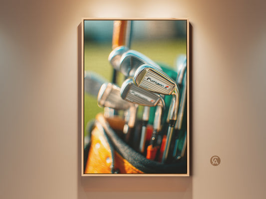 Elevate your space with golf art. This framed artwork features a close-up of golf clubs in a bag. The detailed shot captures the essence of the game. Add a touch of sophistication to your home with this golf-themed art.