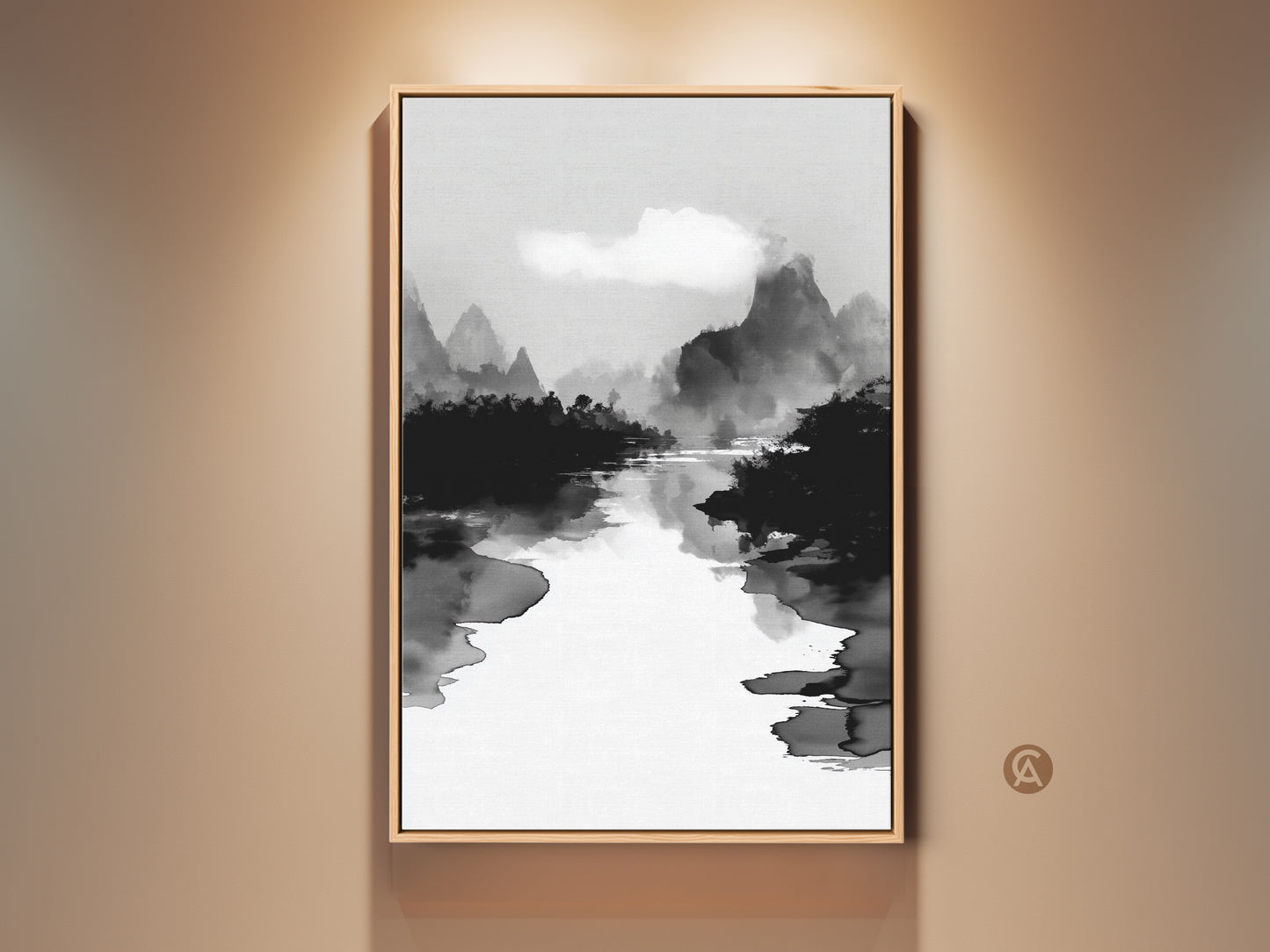 Framed black white ink wash art print on a beige wall. This mountain river landscape canvas adds minimalist nature wall decor to any space. The Japanese Sumi-e style artwork brings a calm aesthetic to your home or office. This fine art print enhances your room's ambiance with its serene monochrome beauty.