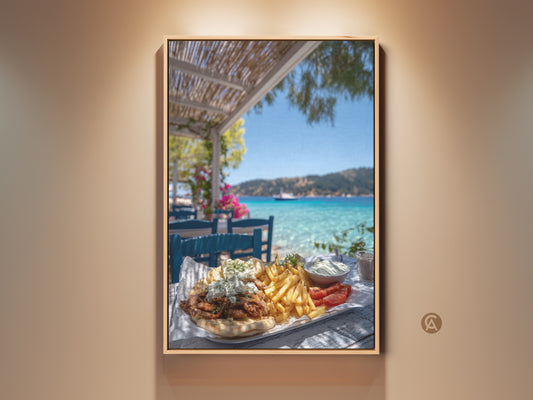 Photorealistic greek gyros platter art print. The canvas captures a summer vacation scene with coastal scenery. The turquoise sea is vibrant in the background.  It's perfect for kitchen or dining coastal home decor. A foodie gift for travel lovers. This artwork will bring sunny days to your home.