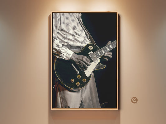 Sepia toned canvas art featuring a guitarist playing an electric guitar. This vintage guitarist print is framed in a natural wood tone. It's perfect eclectic home decor for music lovers. Add a touch of blues and rock and roll to your space with this musician gift idea.