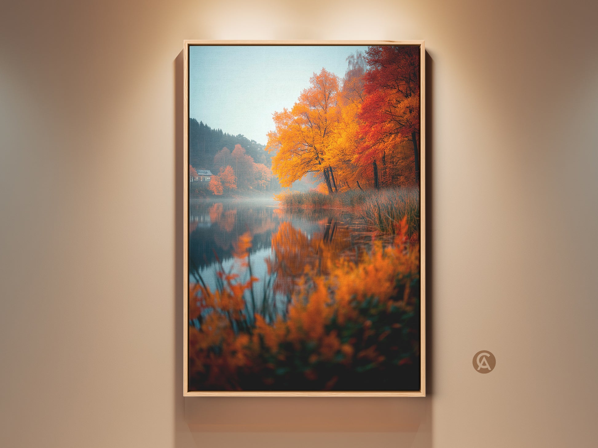 Framed autumn lake artwork. The vibrant fall colors pop. The art brings nature indoors. Displayed on a beige wall. The reflection on the water is very clear. Buy framed canvas art for home decor.