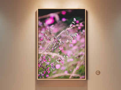 Botanical art print displayed in a wooden frame. This pink wildflower macro photo showcases a soft focus floral canvas. A nature art piece perfect for a bedroom. It's an ideal plant lover gift with its boho aesthetic.
