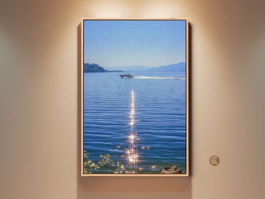 Framed boat on blue water art print. Sparkling ocean canvas art adds a realistic lake landscape to any room. Perfect coastal bedroom wall decor for boat lovers. This summer water scene art is nautical home decor. A modern boat artwork print with calm water on canvas. Makes a great housewarming gift.
