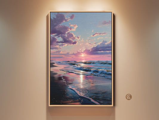 Framed sunset beach art. The sun reflects on the wet sand. Ocean waves crash on the beach. The artwork has a light wood frame. Bring the beauty of the coast to your home with this beach artwork.
