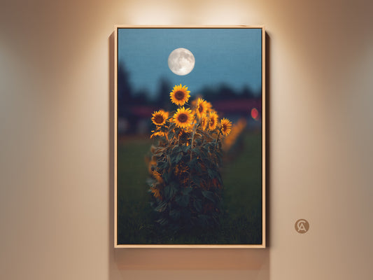 Framed botanical sunflower moon art print on a beige wall. The dreamy artwork features yellow and orange sunflowers under a bright moon. Boho home canvas adds a touch of nature to any room. Perfect gift for Grandma or a unique housewarming present.
