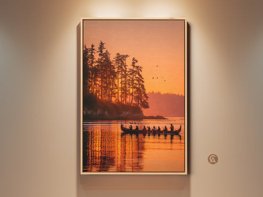 Framed canvas art featuring a stunning sunset over a serene lake. A traditional canoe glides across the water carrying several silhouetted figures. The warm orange hues of the sky beautifully reflect on the water surface. Tall trees line the shore creating a peaceful scenic view. Shop landscape artwork for your home decor.