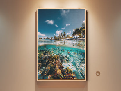 Framed ocean split view wall art featuring a tropical beach and underwater coral reef. This coastal artwork combines deep blue and aqua tones. A perfect tropical gift idea.
