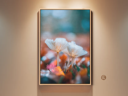 Framed mushroom art print. This wall art features white mushrooms among fall leaves. The floating frame is a light oak color. It's a fine art print for nature lovers. Ready to hang to bring nature indoors.
