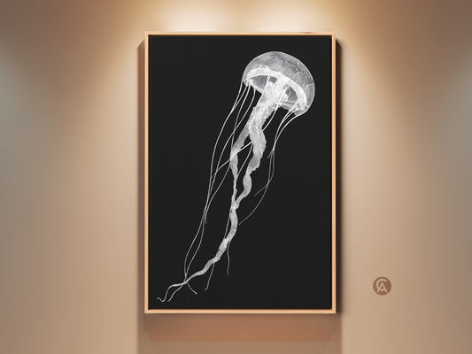 A framed minimalist jellyfish art print hangs on a light beige wall. The black and white line artwork adds contemporary elegance to any room. This ocean sea life wall decor is perfect for coastal living.