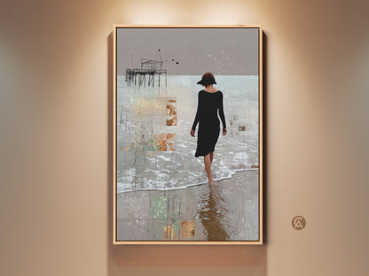 This abstract beach canvas art shows a woman walking along the shore. A pier is in the background. This figurative print features beige brown and gray tones. It is neutral home decor for a calm coastal vibe. Consider this contemporary pier print as a housewarming gift.