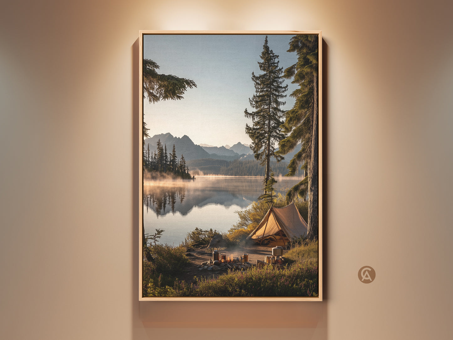 Rustic mountain lake tent canvas art framed in a natural wood finish. The artwork features a serene camping scene. It shows a tent by the calm lake waters reflecting the mountains. This outdoor adventure landscape is ideal for cozy bedroom art or as a thoughtful housewarming gift.