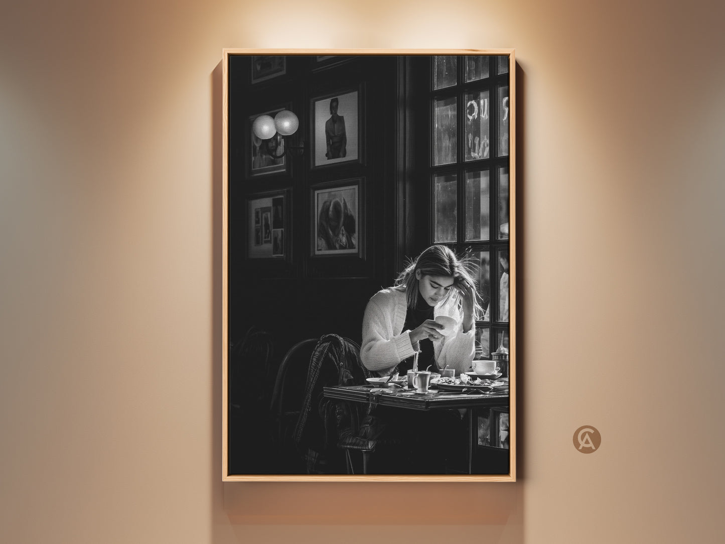 Monochrome cafe scene wall art. This contemporary black and white photojournalism style print features a woman with coffee. It's perfect dining room decor. The artwork brings a sophisticated lifestyle aesthetic to any contemporary space. It makes a thoughtful gift for coffee lovers and housewarming occasions.