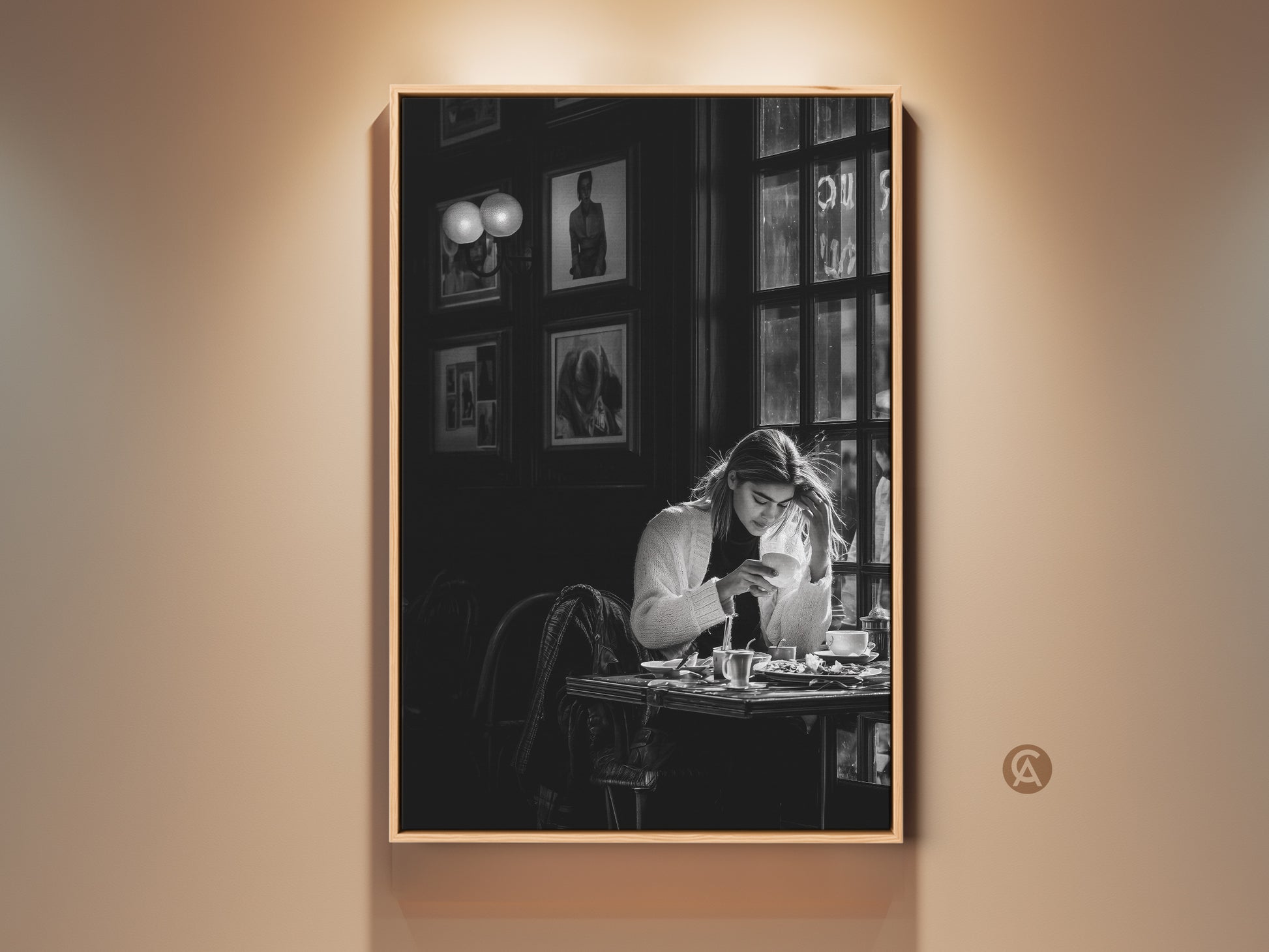 Monochrome cafe scene wall art. This contemporary black and white photojournalism style print features a woman with coffee. It's perfect dining room decor. The artwork brings a sophisticated lifestyle aesthetic to any contemporary space. It makes a thoughtful gift for coffee lovers and housewarming occasions.