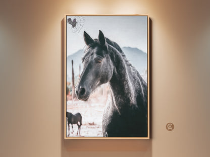 Framed photorealistic horse canvas art. The black horse portrait features a rustic mountain backdrop. Perfect wildlife art for a lodge-style living room or a gift for equestrian enthusiasts. The frame accents the beauty of this animal photography canvas.