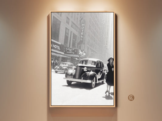 Vintage Car Art Print featuring a black and white cityscape. This Art Deco canvas showcases a classic auto and a woman in a hat. Perfect for Industrial Loft decor. An elegant monochrome wall hanging for entry halls and home offices. A timeless piece of automotive artwork.