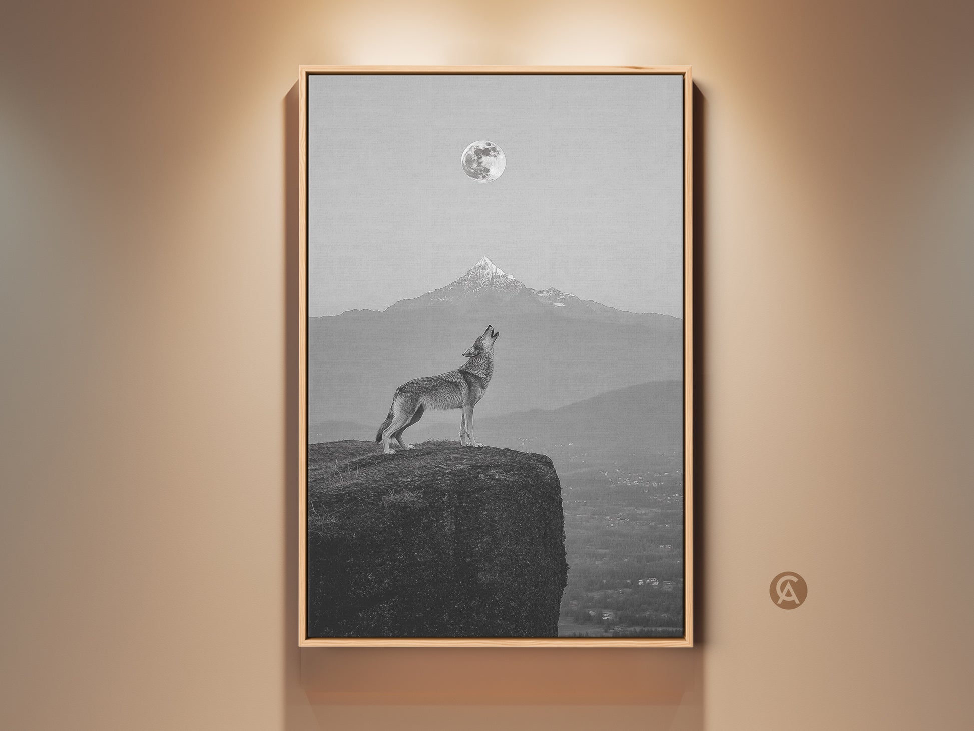 Framed wolf howling at moon canvas print. Monochrome mountain landscape art in a modern bedroom. The outdoor themed home decor is an elegant monochrome decor piece.