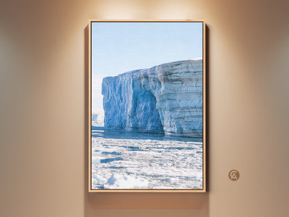 Framed minimalist iceberg wall art. This light blue glacier canvas print features Arctic landscape photography. A contemporary home decor gift framed in oak bringing serene glacier scenes to any room.