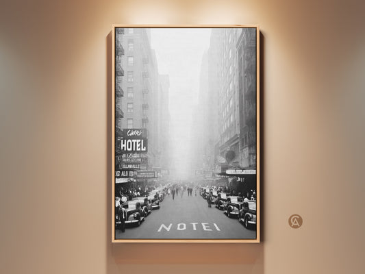 Vintage black and white cityscape canvas. Features retro cars and a HOTEL sign. This industrial loft wall art brings classic charm to any room. A perfect travel lover gift. Ideal for home decor or office spaces.