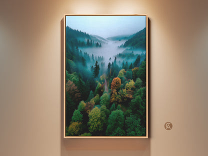 Framed forest artwork capturing a misty mountain valley. The aerial perspective highlights the lush green trees. Hints of fall colors create a vibrant landscape. This framed art is perfect for nature lovers seeking serene wall decor.