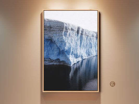 Framed Minimalist Glacier wall art reflecting in water. The ice blue arctic landscape is printed on canvas. Modern home decor for travel lovers. A perfect housewarming gift.