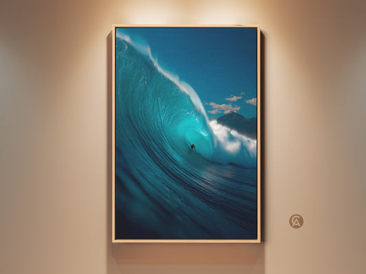 Framed ocean wave art print. This artwork features a surfer riding inside a massive blue wave. The gallery-quality print is framed in a natural wood finish. Perfect coastal art for any room.