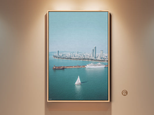 Ocean Cityscape Aerial Art Print in a wood frame. Features a sailboat cruise ship wall decor in a blue teal modern photography style. Perfect travel lover gift and wall art.