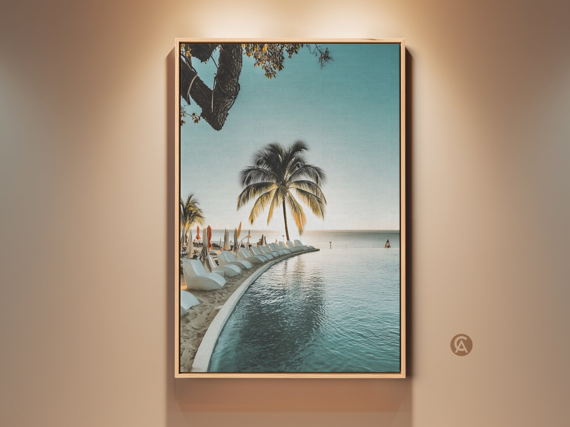 Framed tropical palm tree wall art. A coastal infinity pool canvas print brings beach ocean views. Relaxed home decor gift idea. This artwork features serene aqua and blue tones. Perfect for adding a vacation paradise ambiance to your living space.