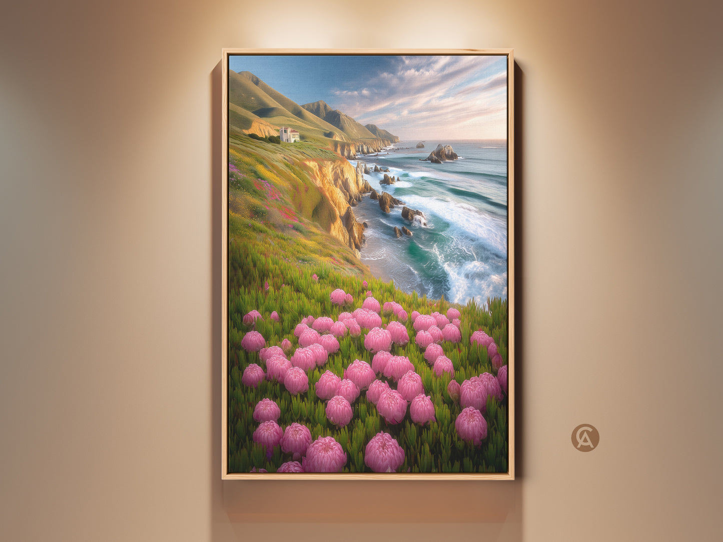Pink Floral Coastal Canvas artwork displays a framed print. This nature art captures ocean cliffs and green hills. This beach house wall decor is a beautiful housewarming gift.
