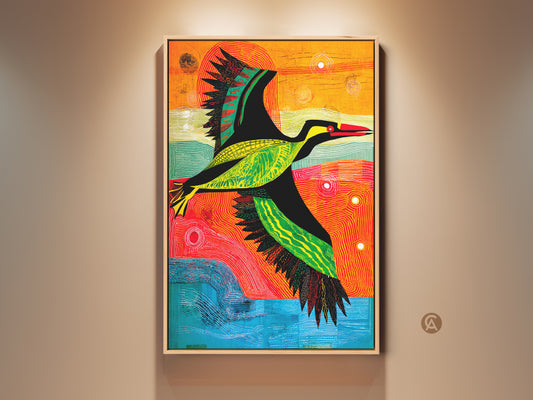 A tribal bird canvas print displays in a brightly lit room. This modern folk art features green orange and blue hues. The eclectic wall hanging adds a vibrant artistic statement. Perfect unique wall decor for nature lovers a great housewarming gift art.