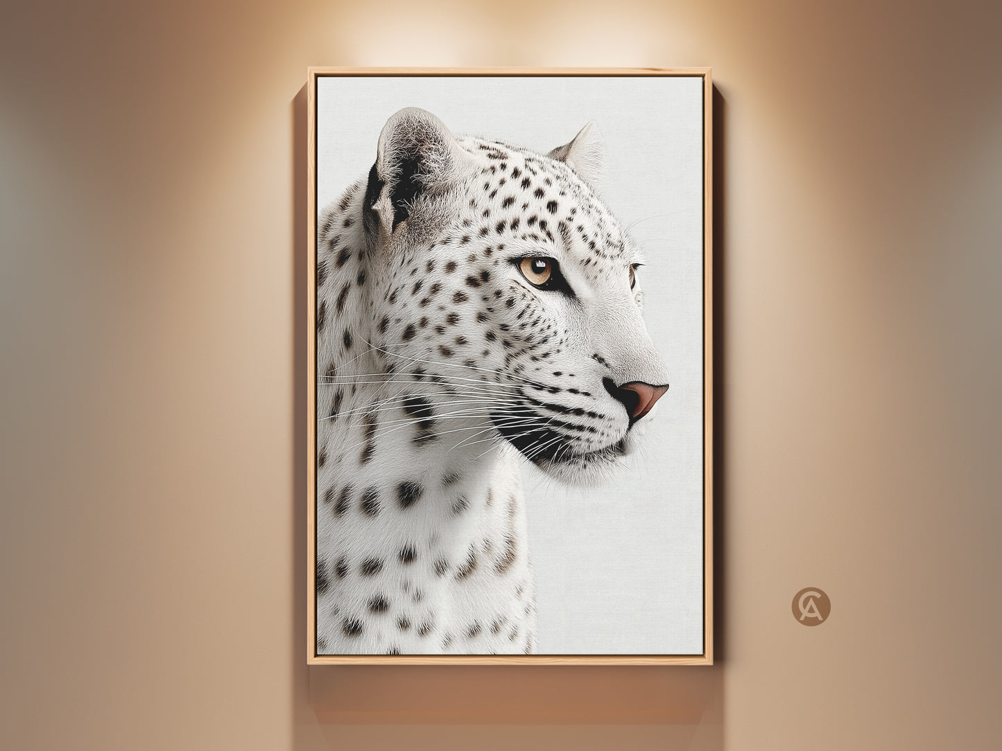 Realistic Snow Leopard canvas artwork framed in gold hangs on a neutral wall. This monochrome big cat artwork brings wildlife charm to modern interiors. This canvas print is ideal for animal lovers seeking sophisticated wildlife home decor.