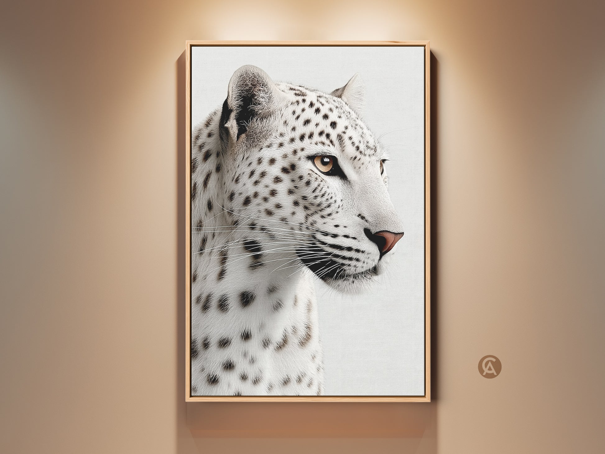 Realistic Snow Leopard canvas artwork framed in gold hangs on a neutral wall. This monochrome big cat artwork brings wildlife charm to modern interiors. This canvas print is ideal for animal lovers seeking sophisticated wildlife home decor.
