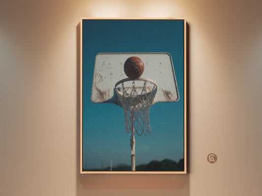 Framed Retro Basketball Hoop Canvas Print. This vintage sports wall art adds an industrial touch to any man cave decor. The teal blue aesthetic creates a unique vibe. It's a perfect gift for basketball lovers looking for sports photography prints.