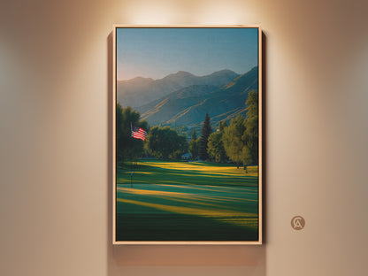 Framed canvas artwork print featuring a golf course at sunrise. An American flag waves gently. Mountains rise in the background. Perfect wall art for golf lovers. Buy it now to add a scenic touch to your home decor.