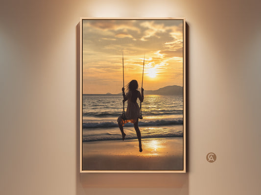 Coastal boho wall art featuring a woman on a swing at sunset. Golden orange ocean waves create a serene beach scene. The artwork is a canvas print perfect for adding a touch of summer vacation to your home decor. A beautiful residential ocean view art piece.